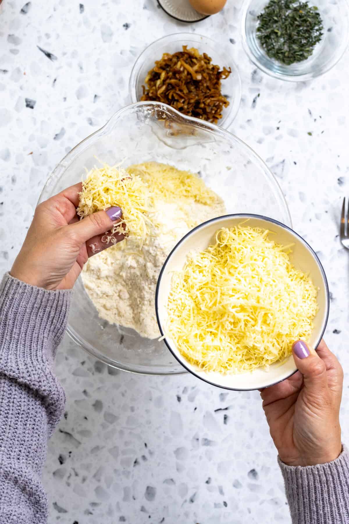 adding cheese to scone dough