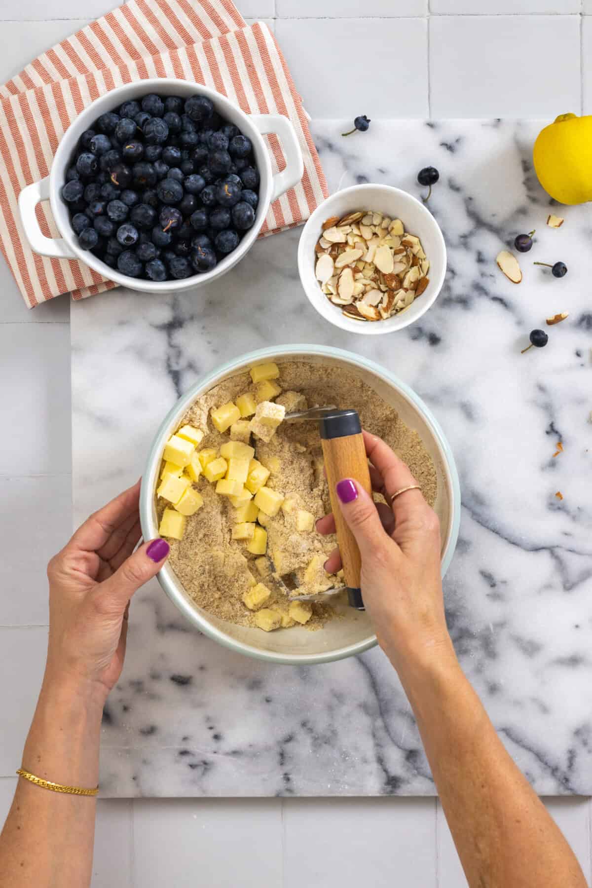 cutting butter into dry ingredients for shortbread crust