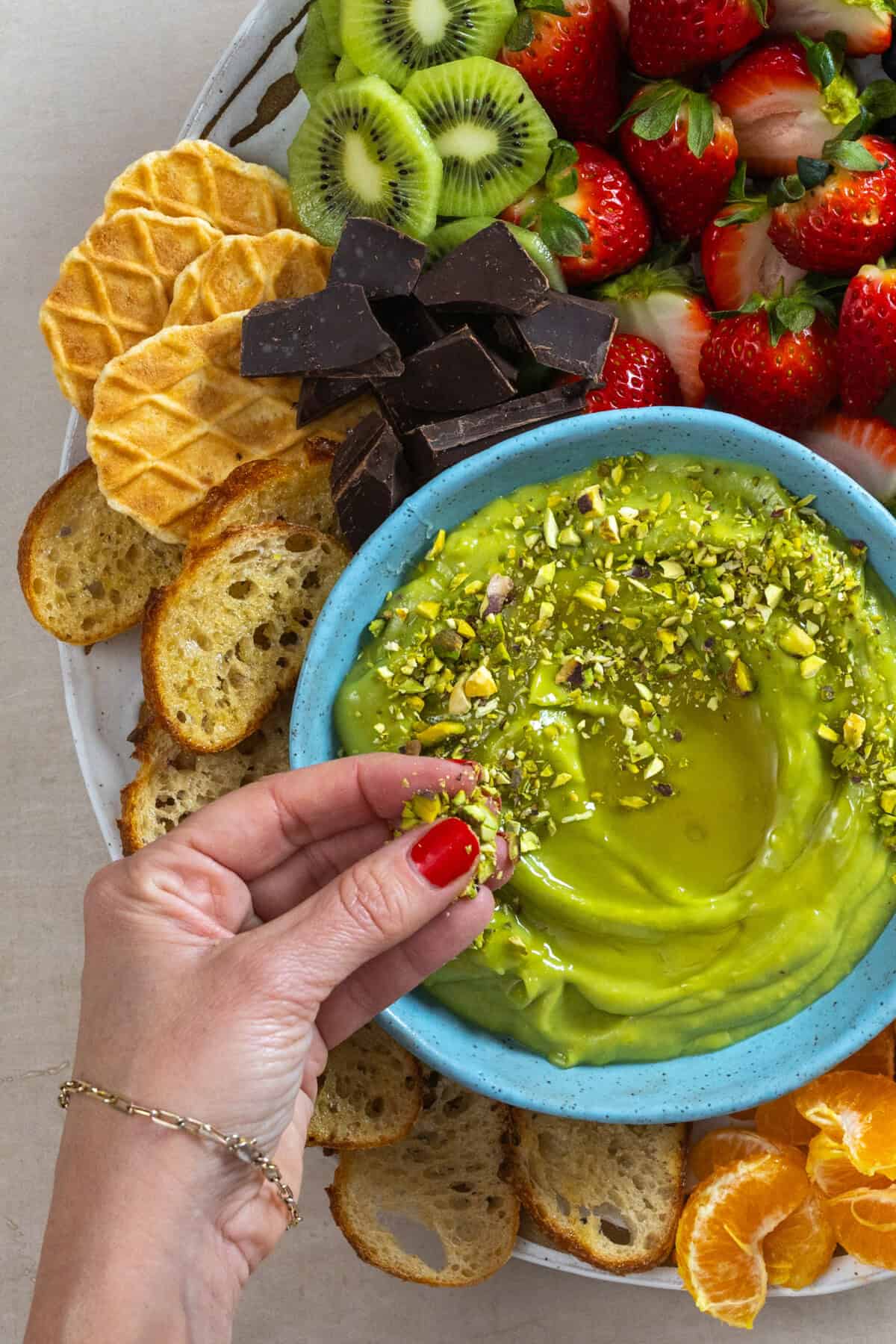 Topping Avocado Dip with chopped pistachios