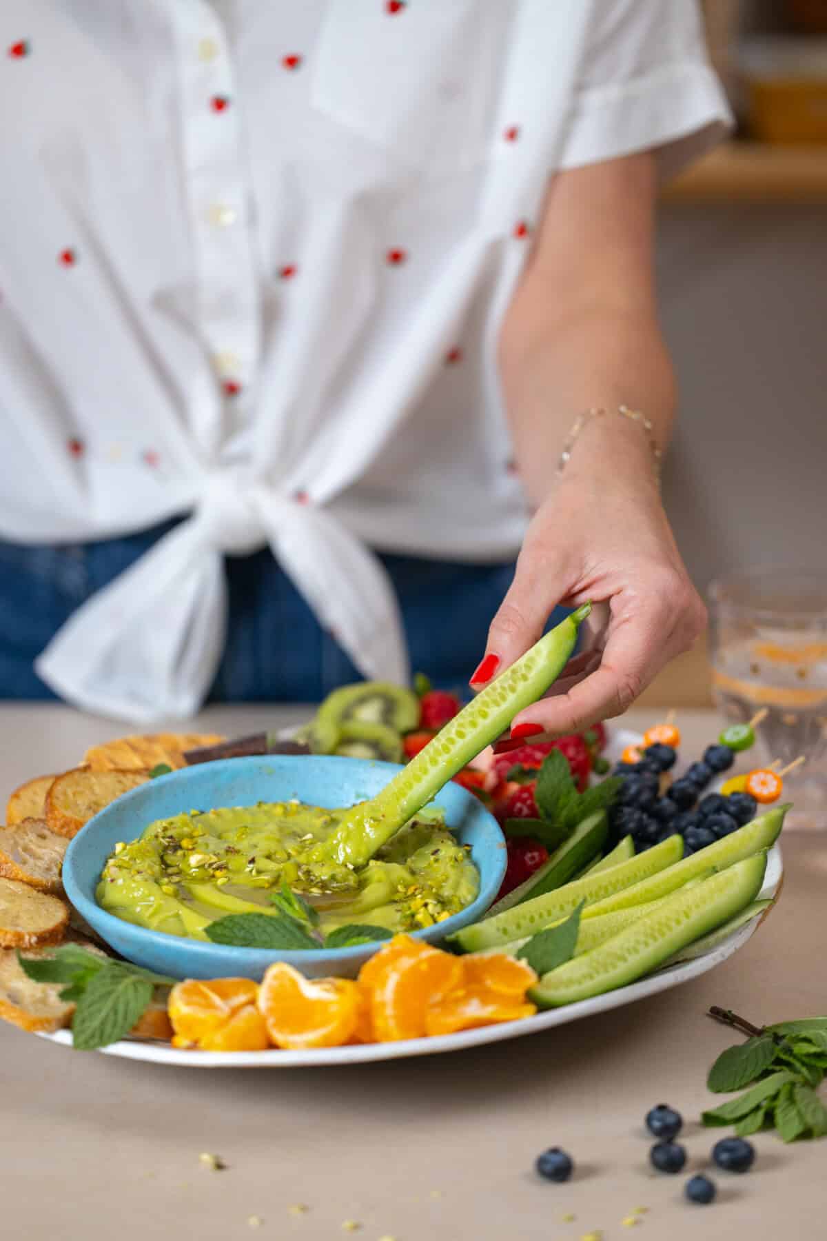Honey Citrus Avocado Dip with fresh fruit, toasted baguette, cookies & chocolate