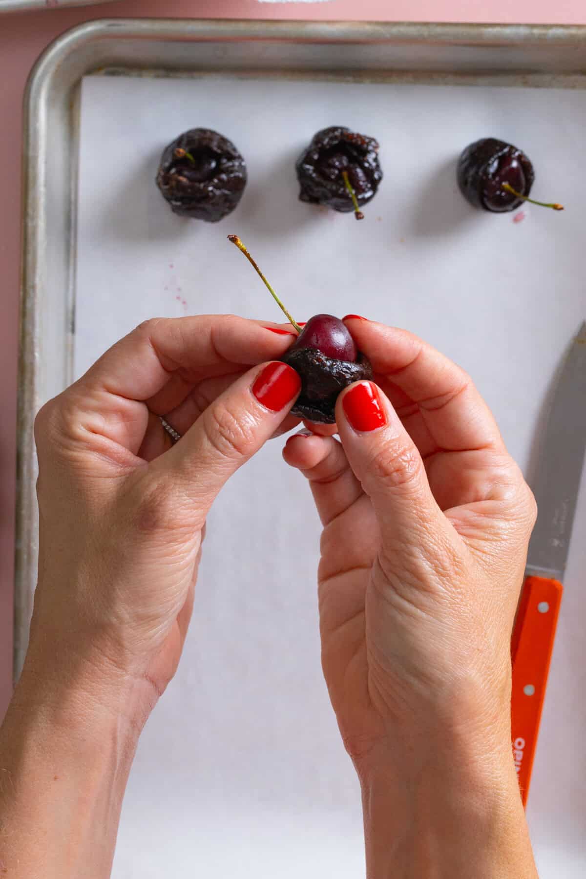 Stuffing prunes with brandy soaked cherries