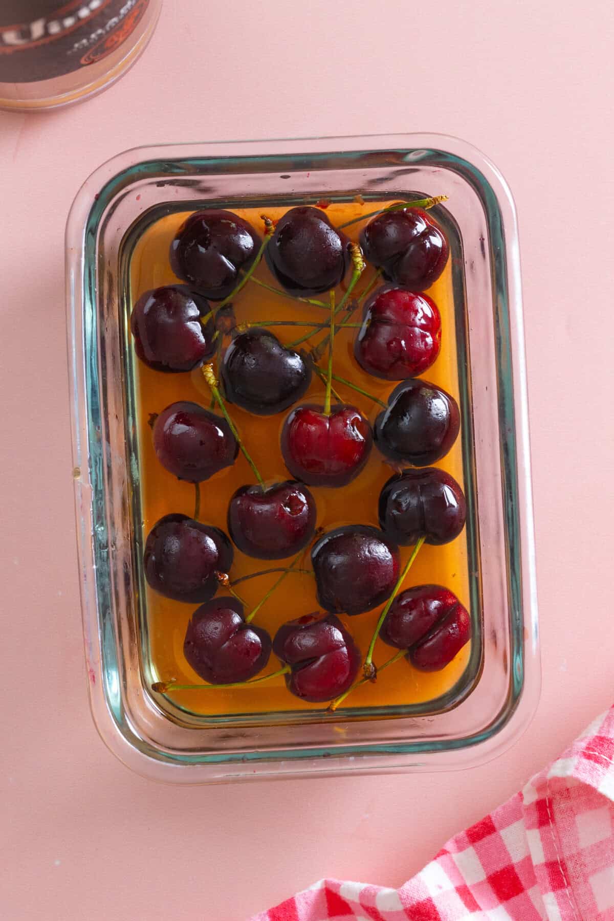 Cherries soaking in brandy simple syrup