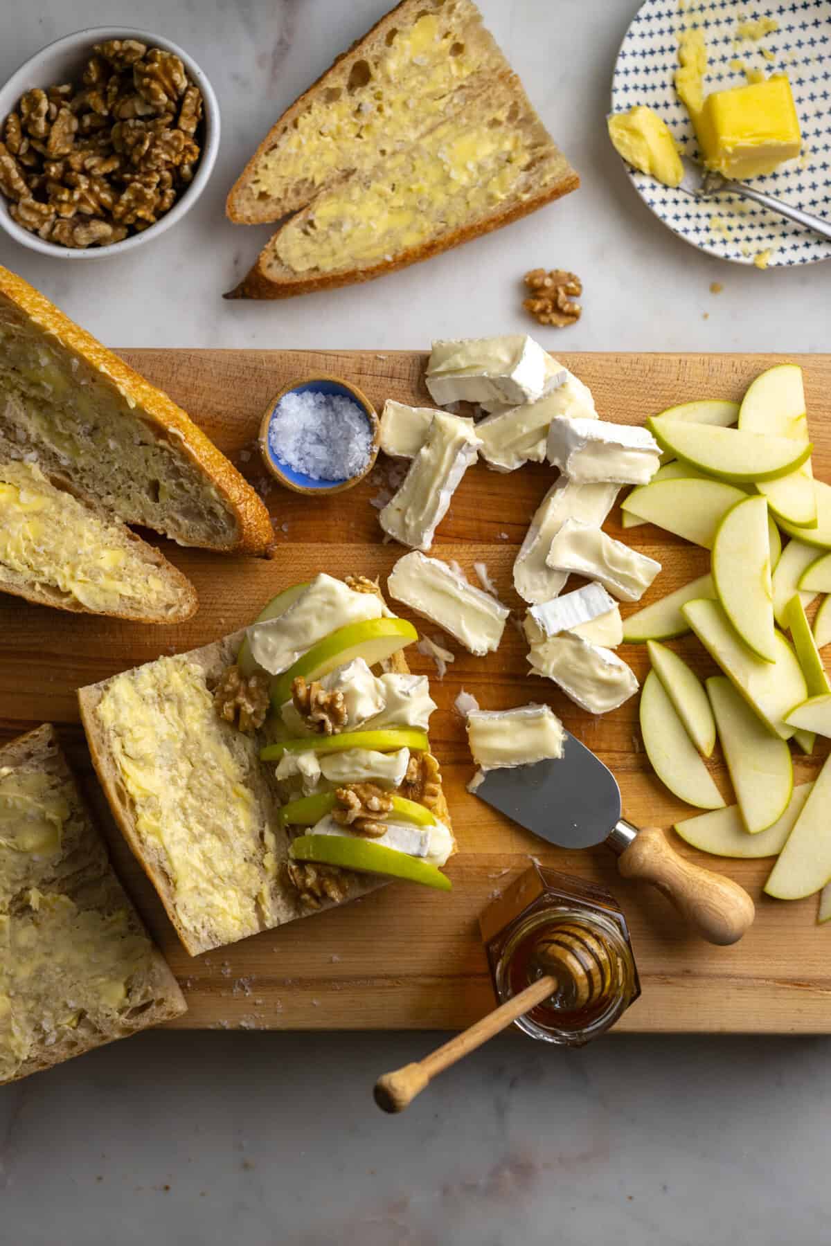 Brie and apples shingled on Apple Brie Baguette Sandwich