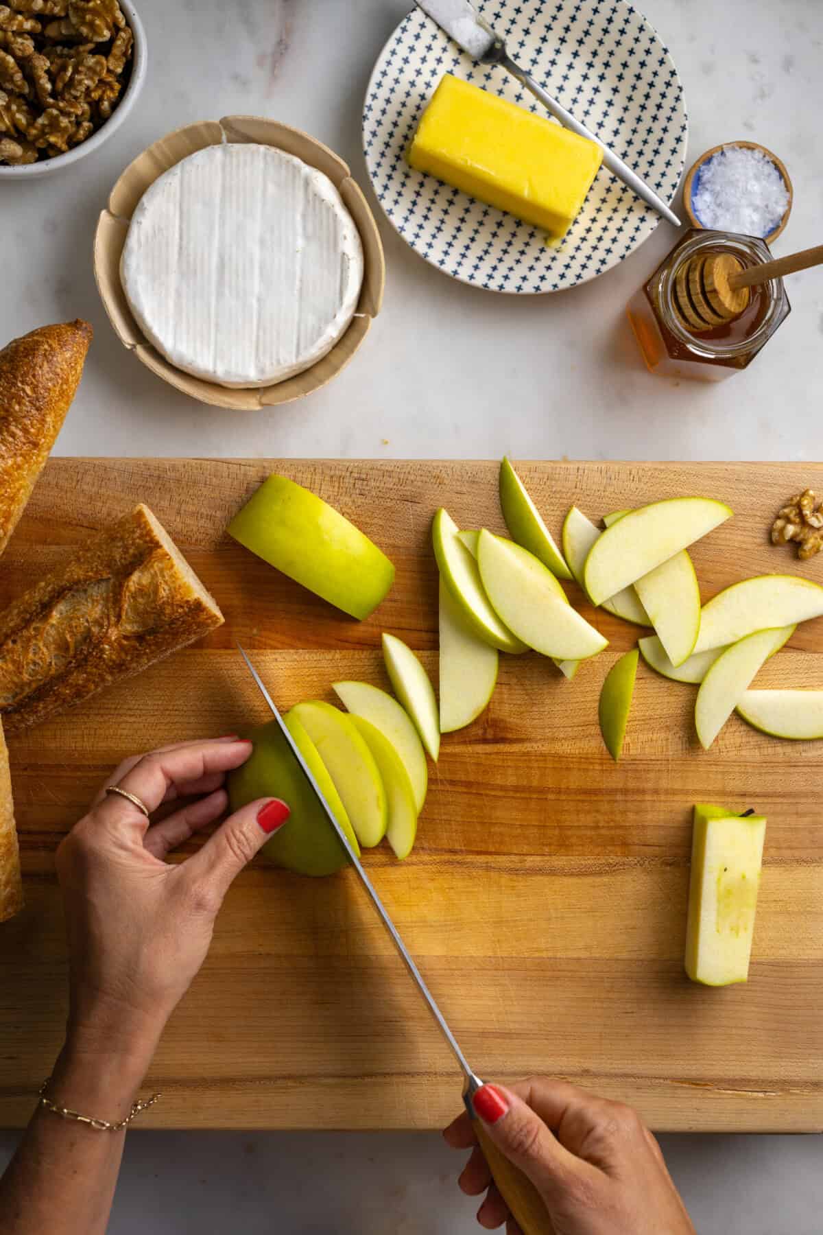 Slicing Granny Smith Apples for baguette sandwiches