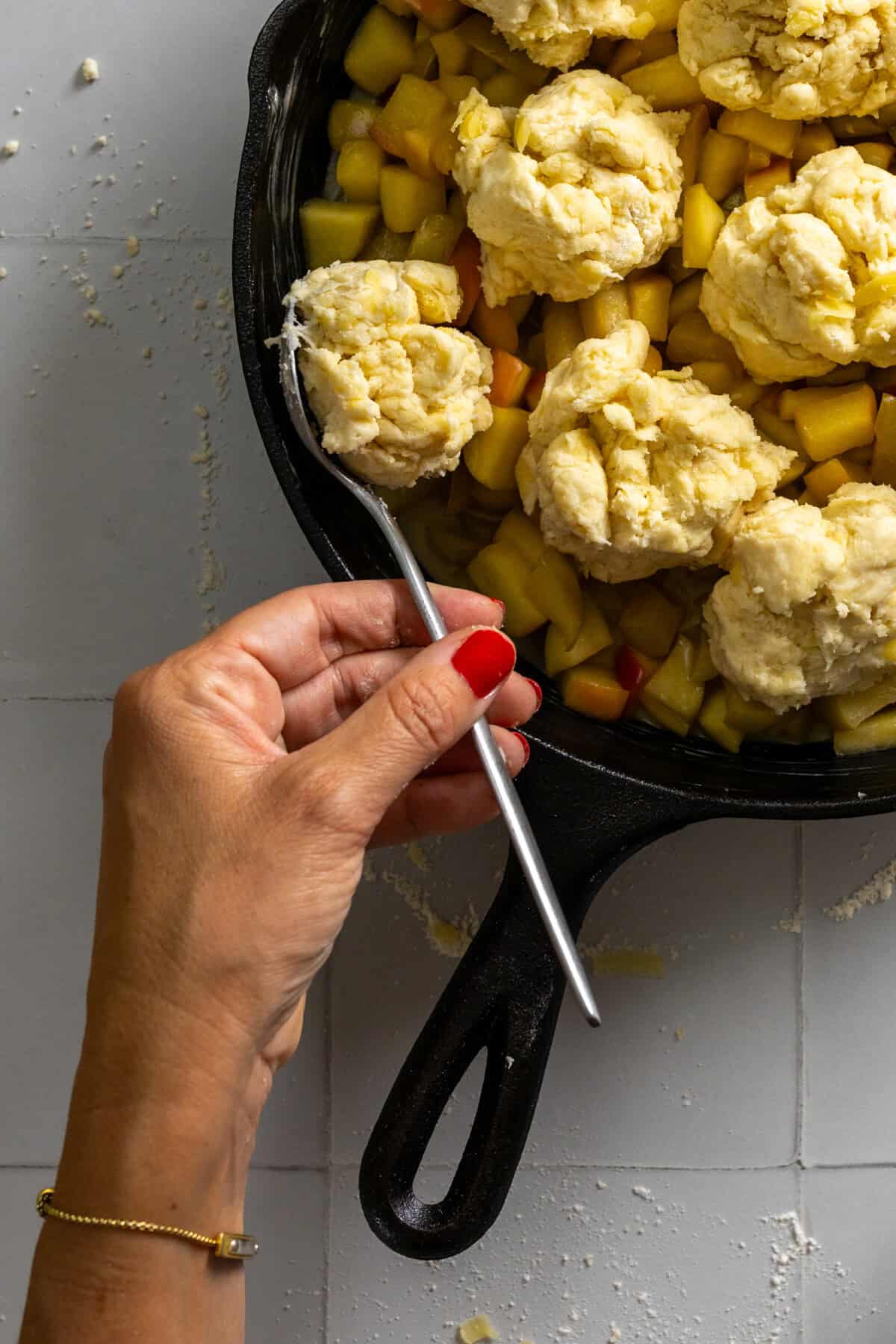 Topping apple filling with cheddar drop biscuits