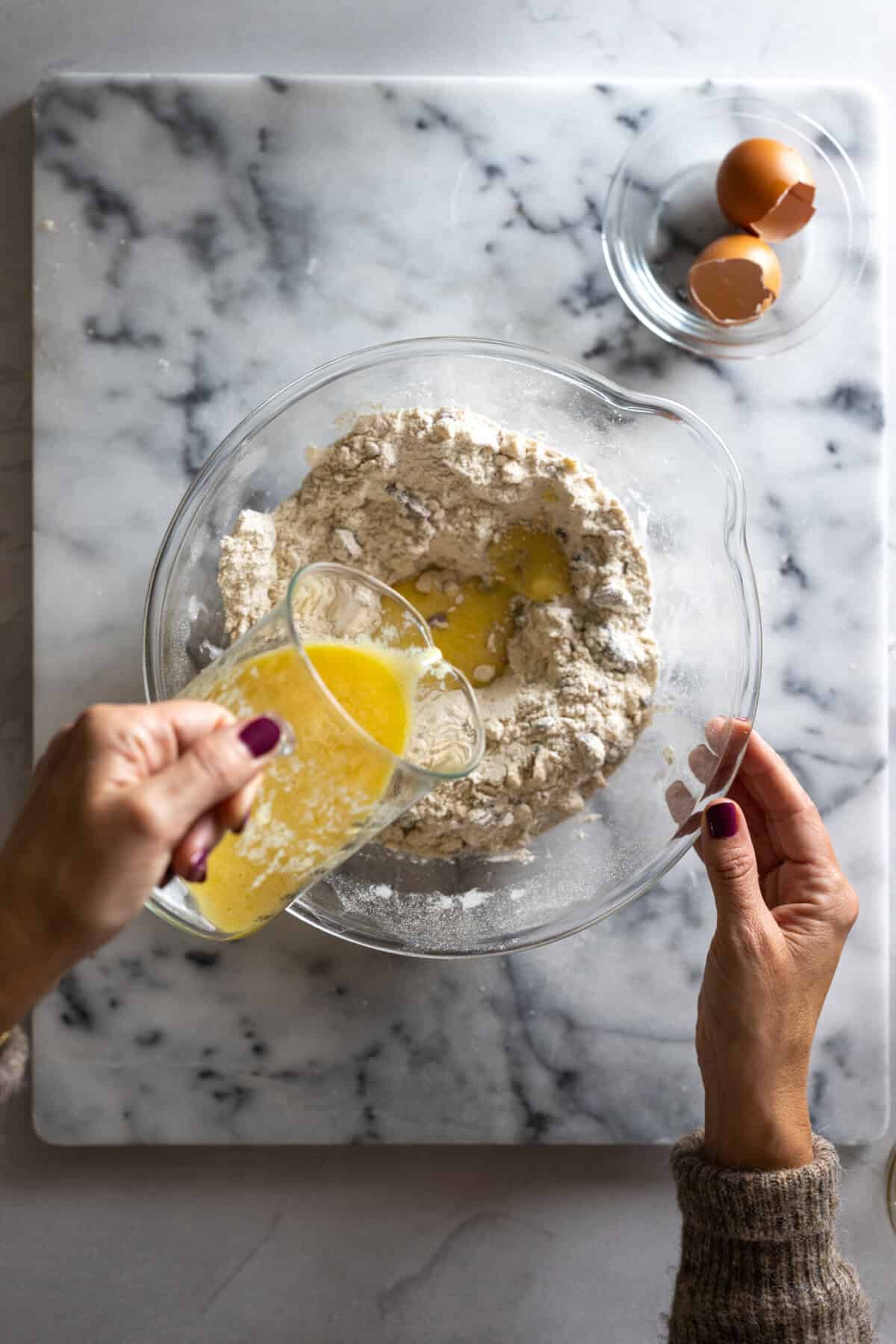mixing wet ingredients into dry scone ingredients