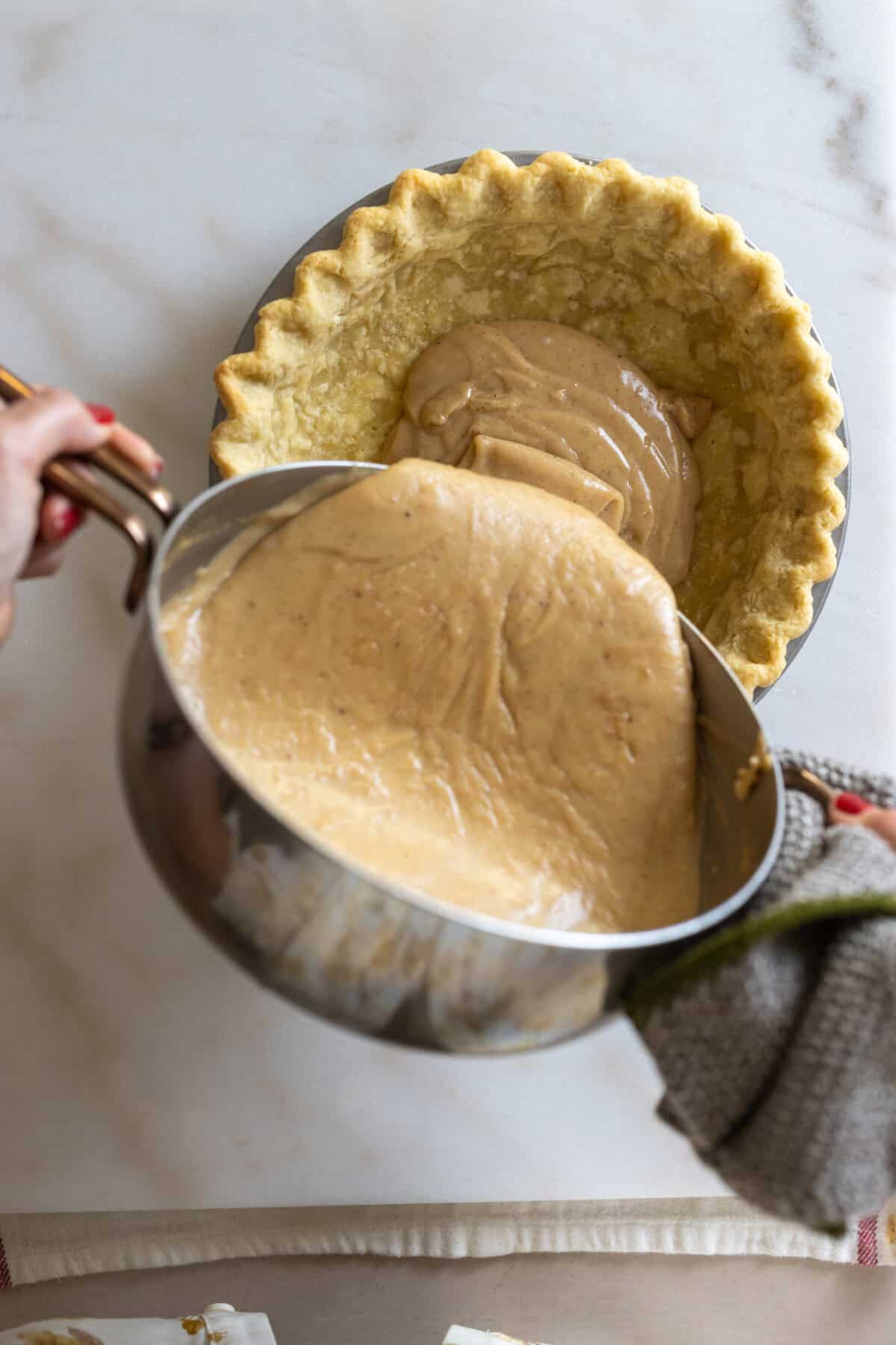 Pouring the filling into pie shell