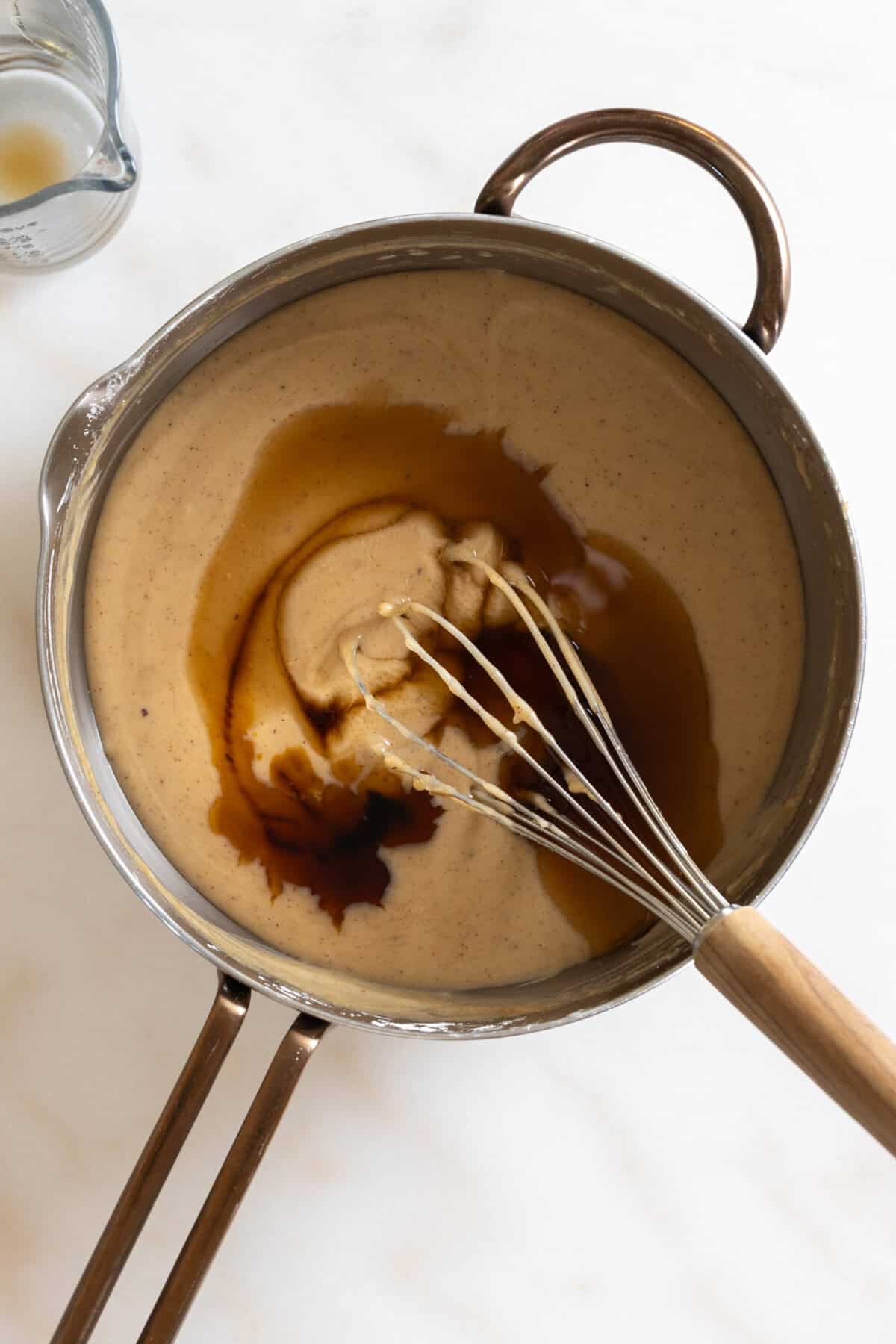 stirring rum & vanilla into Hot Buttered Rum Sugar Cream Pie filling