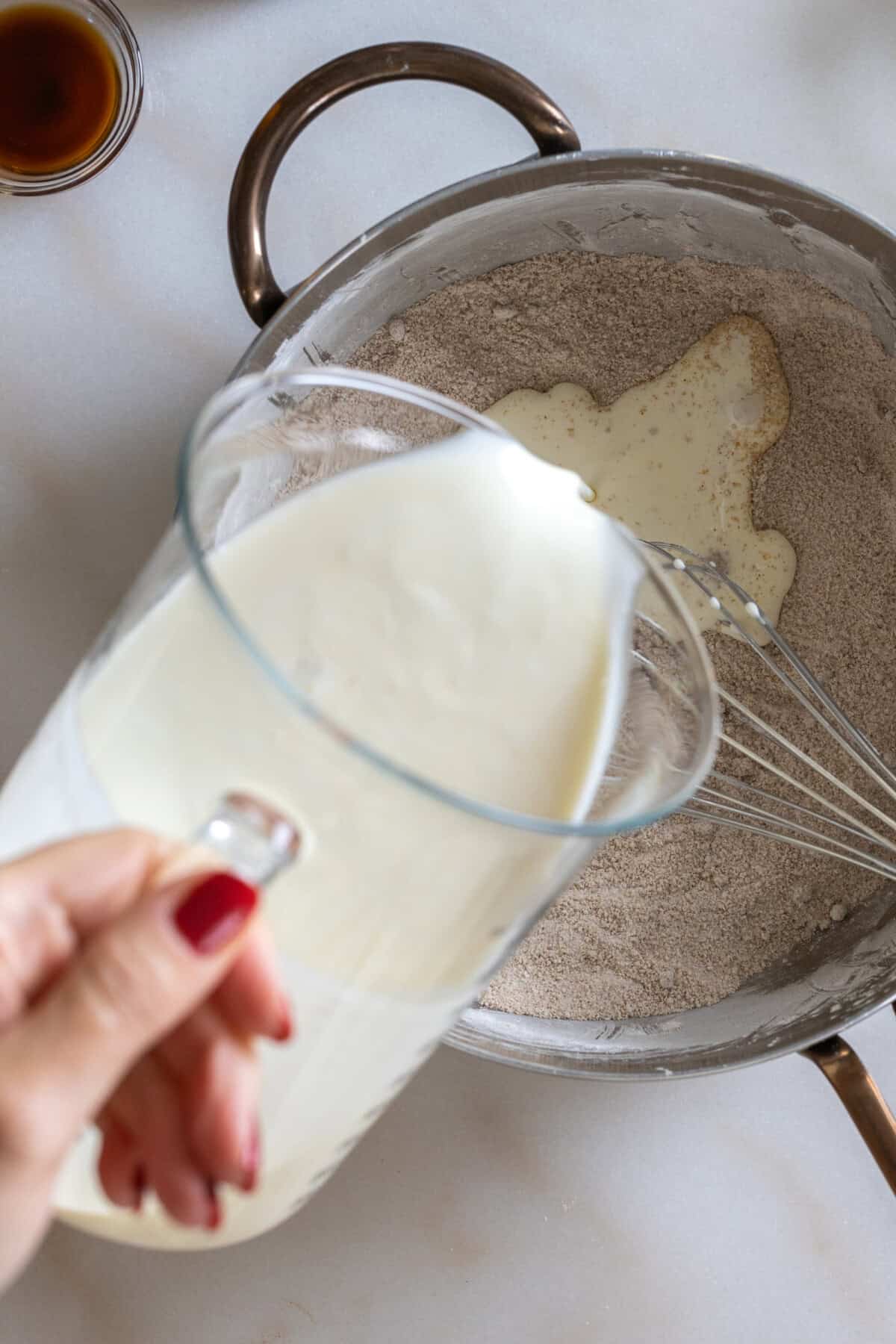 Heavy cream pours into pie filling