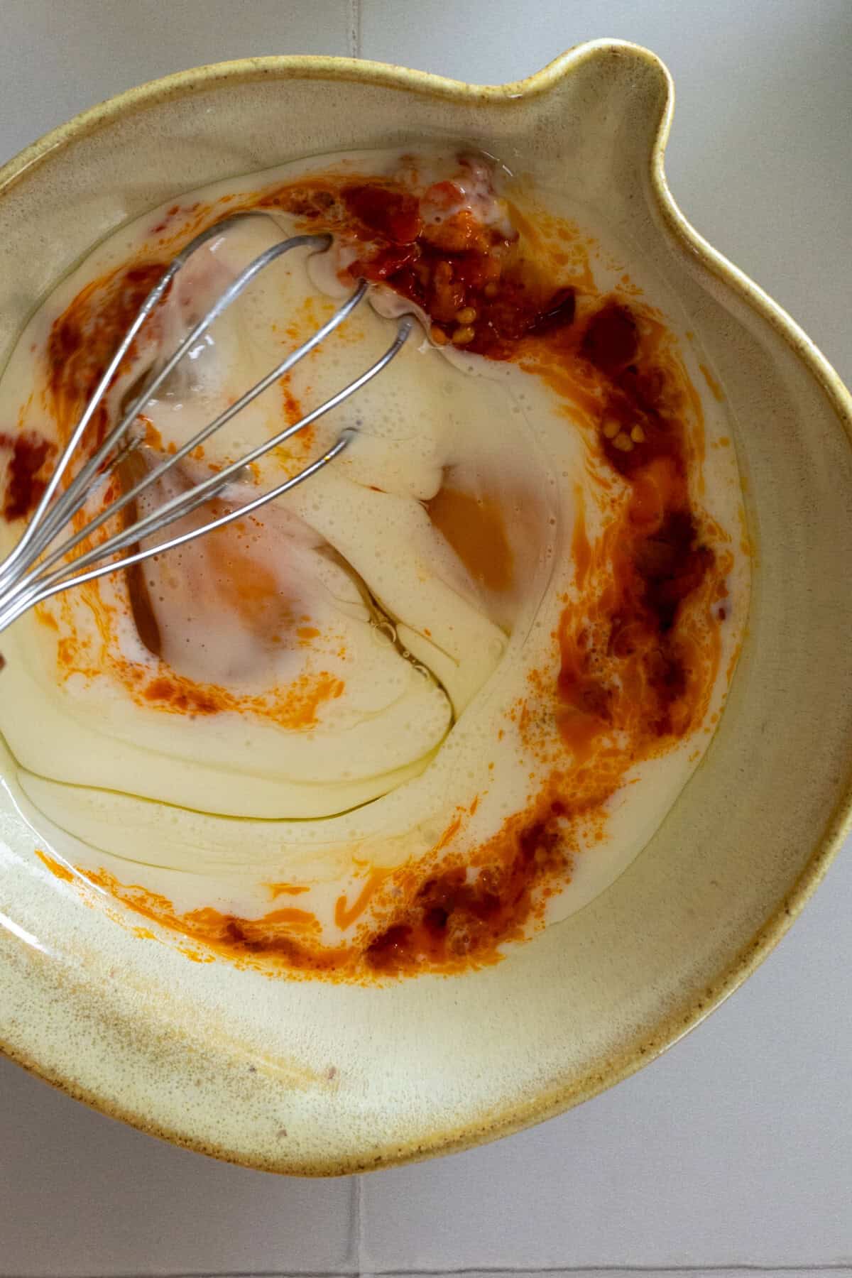 whisking wet ingredients for scones