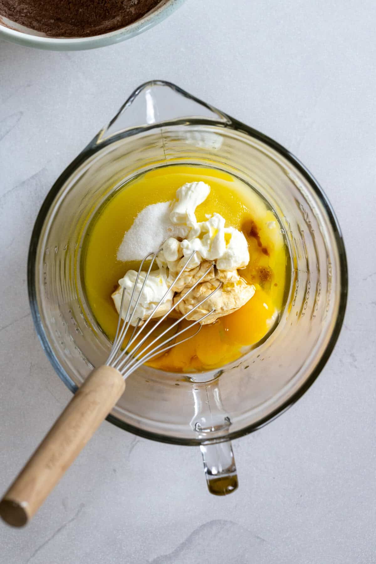 whisking wet ingredients for chocolate cake