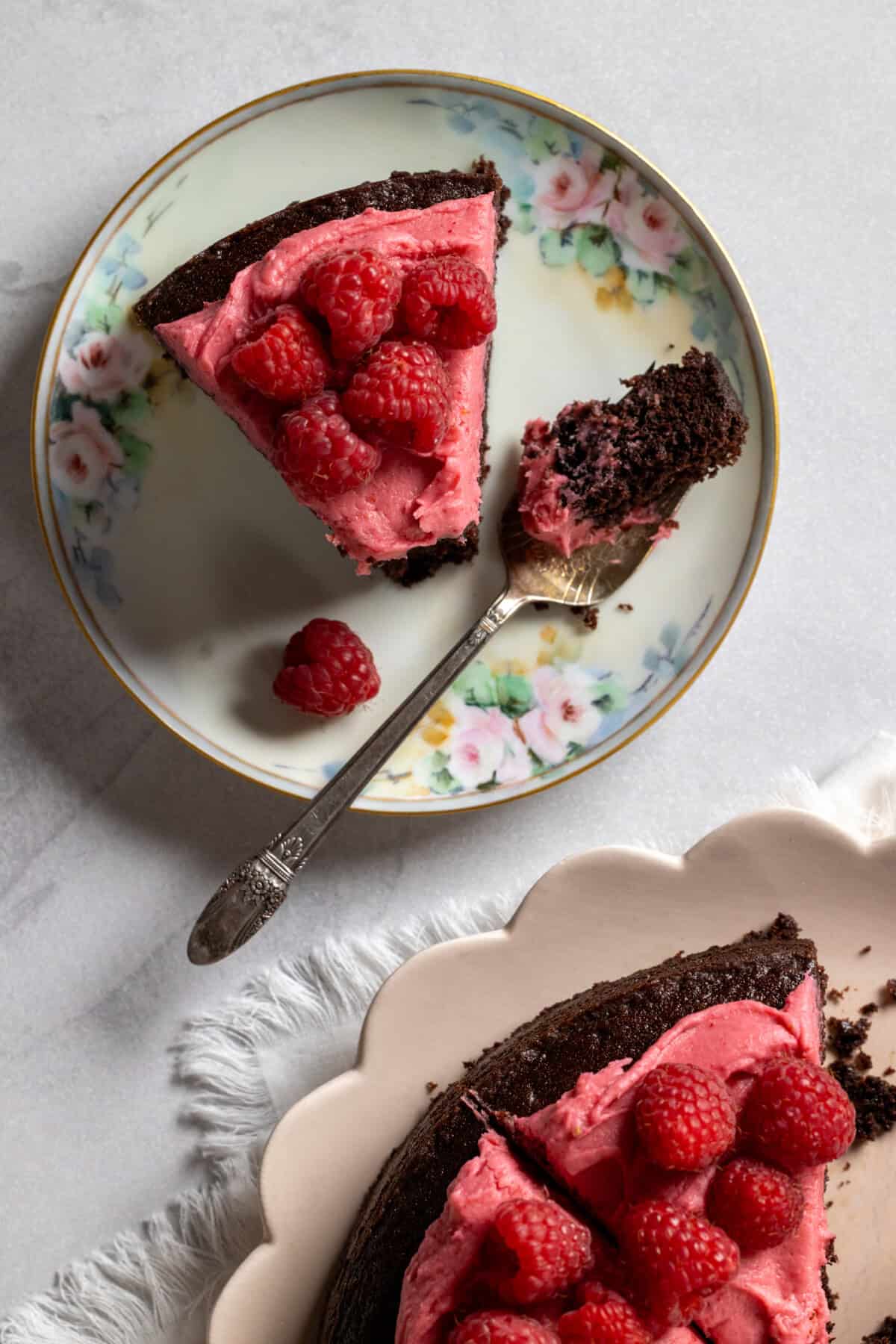 Slice of Chocolate Raspberry Cake with Cream Cheese Frosting