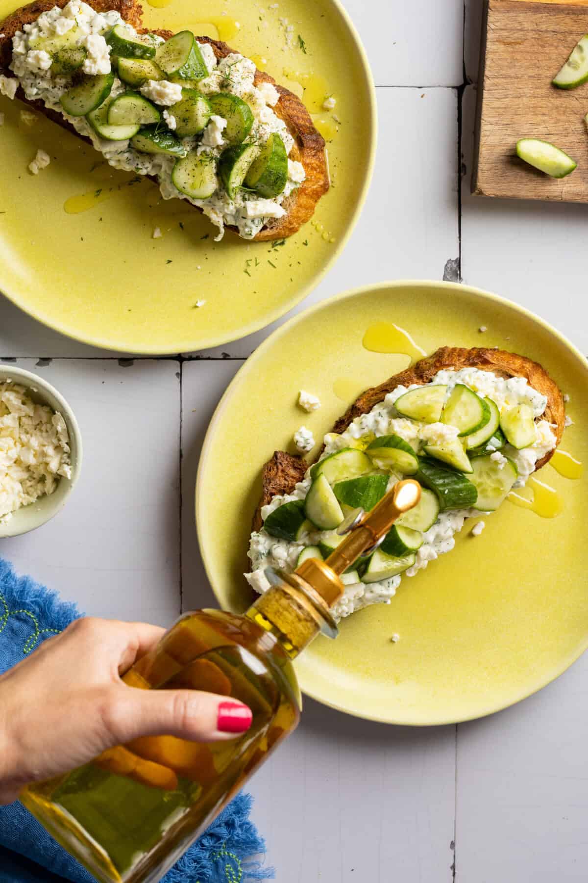 Drizzling olive oil onto toast
